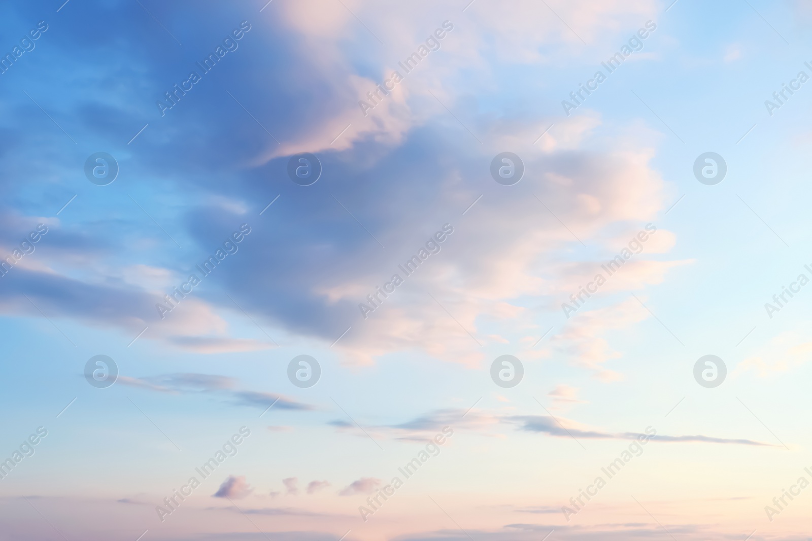 Photo of Picturesque view of beautiful blue sky with clouds at sunset