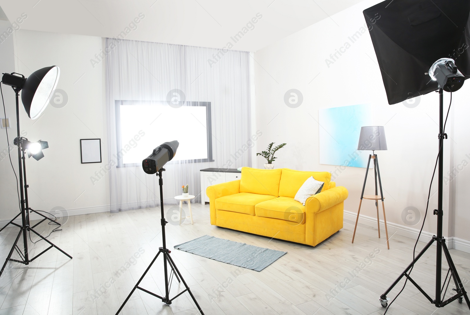 Photo of Example of living room interior design and professional equipment in photo studio