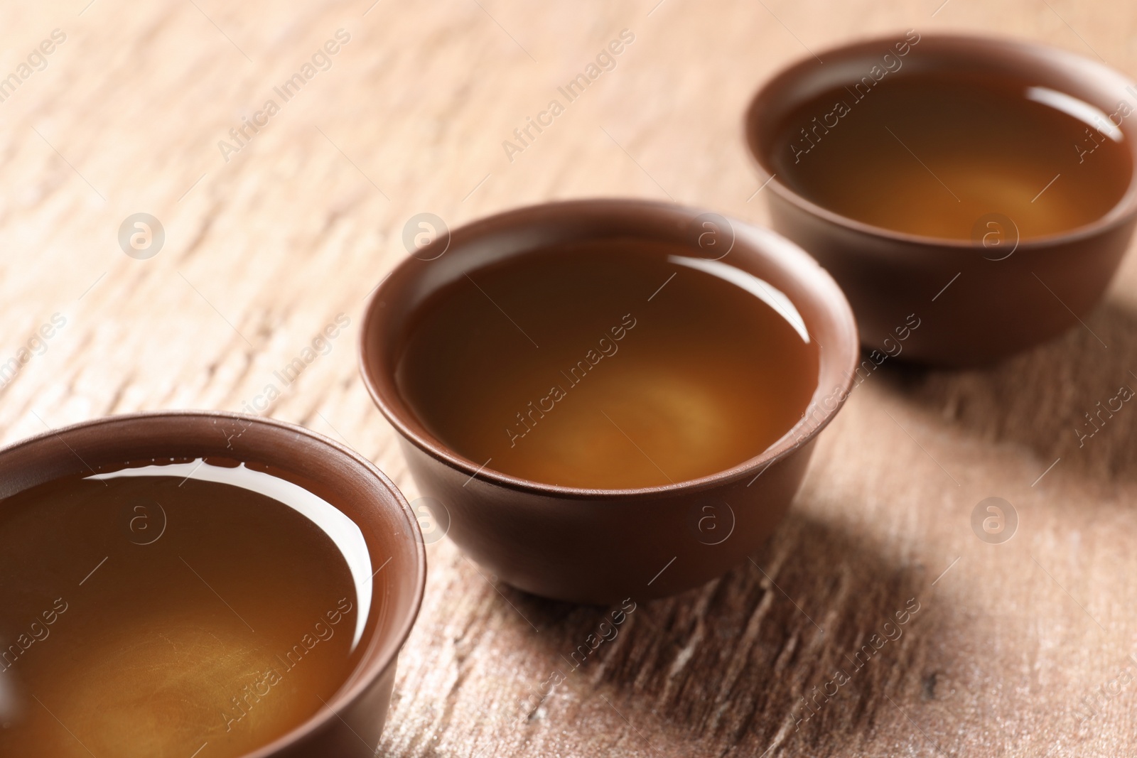 Photo of Cups of Tie Guan Yin oolong tea on table