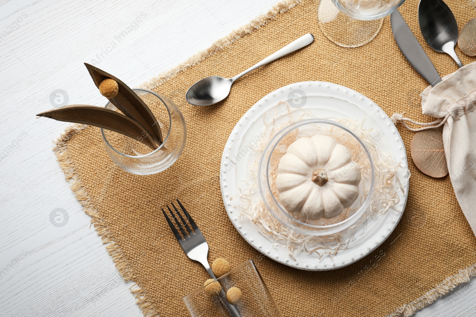 Photo of Autumn table setting with pumpkin on white wooden background, flat lay