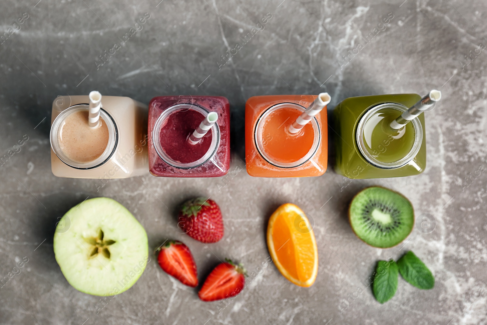 Photo of Flat lay composition with healthy detox smoothies and ingredients on table