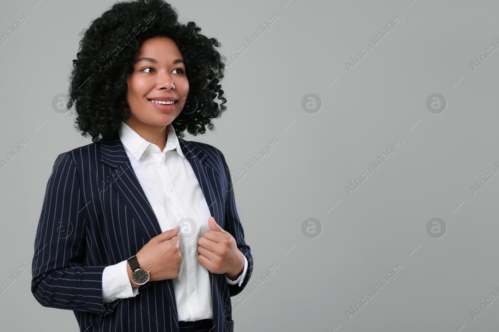 Photo of Young businesswoman in formal outfit on grey background. Space for text