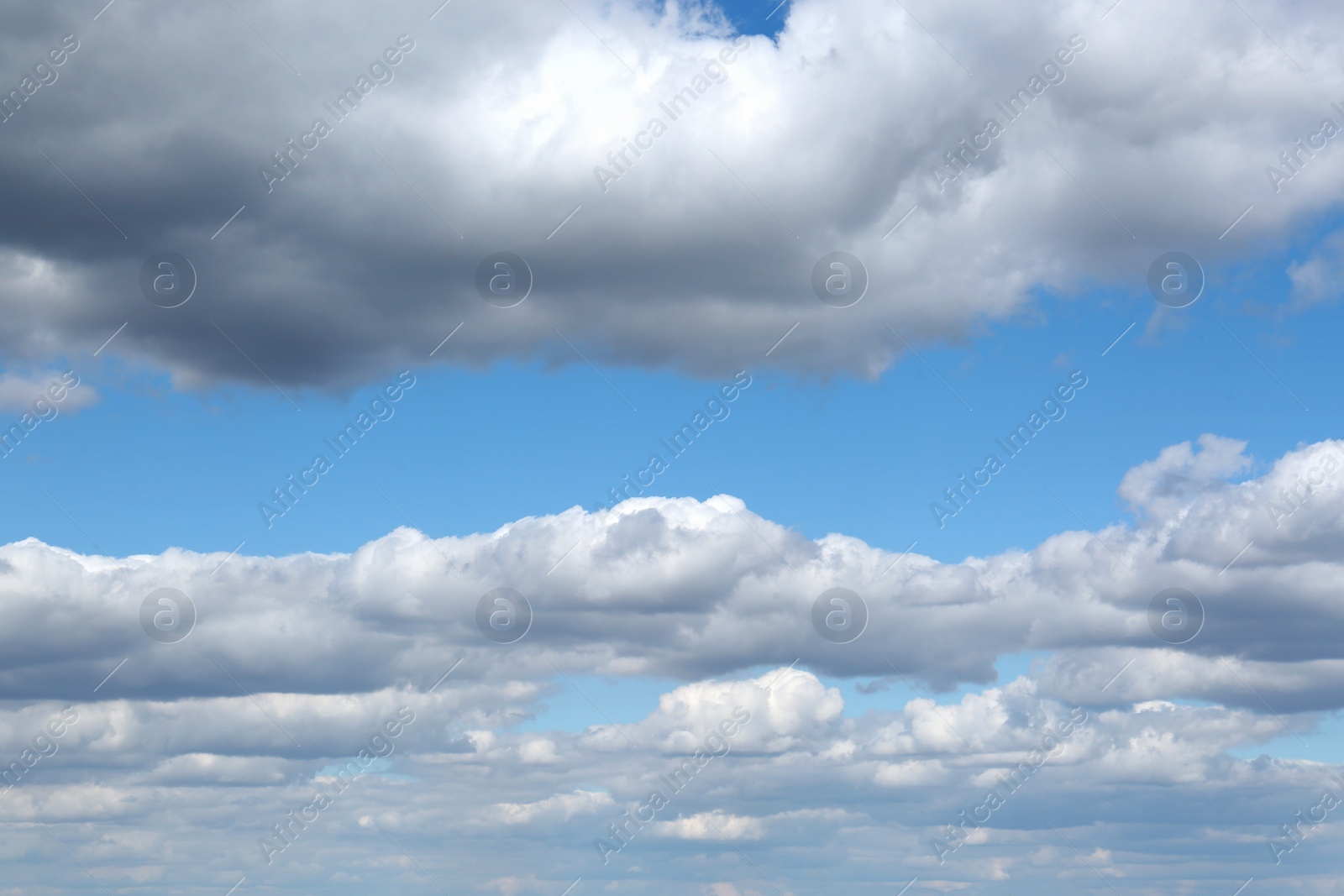 Photo of Beautiful fluffy clouds in light blue sky