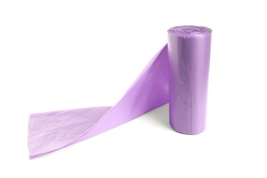 Photo of Roll of violet garbage bags on white background. Cleaning supplies
