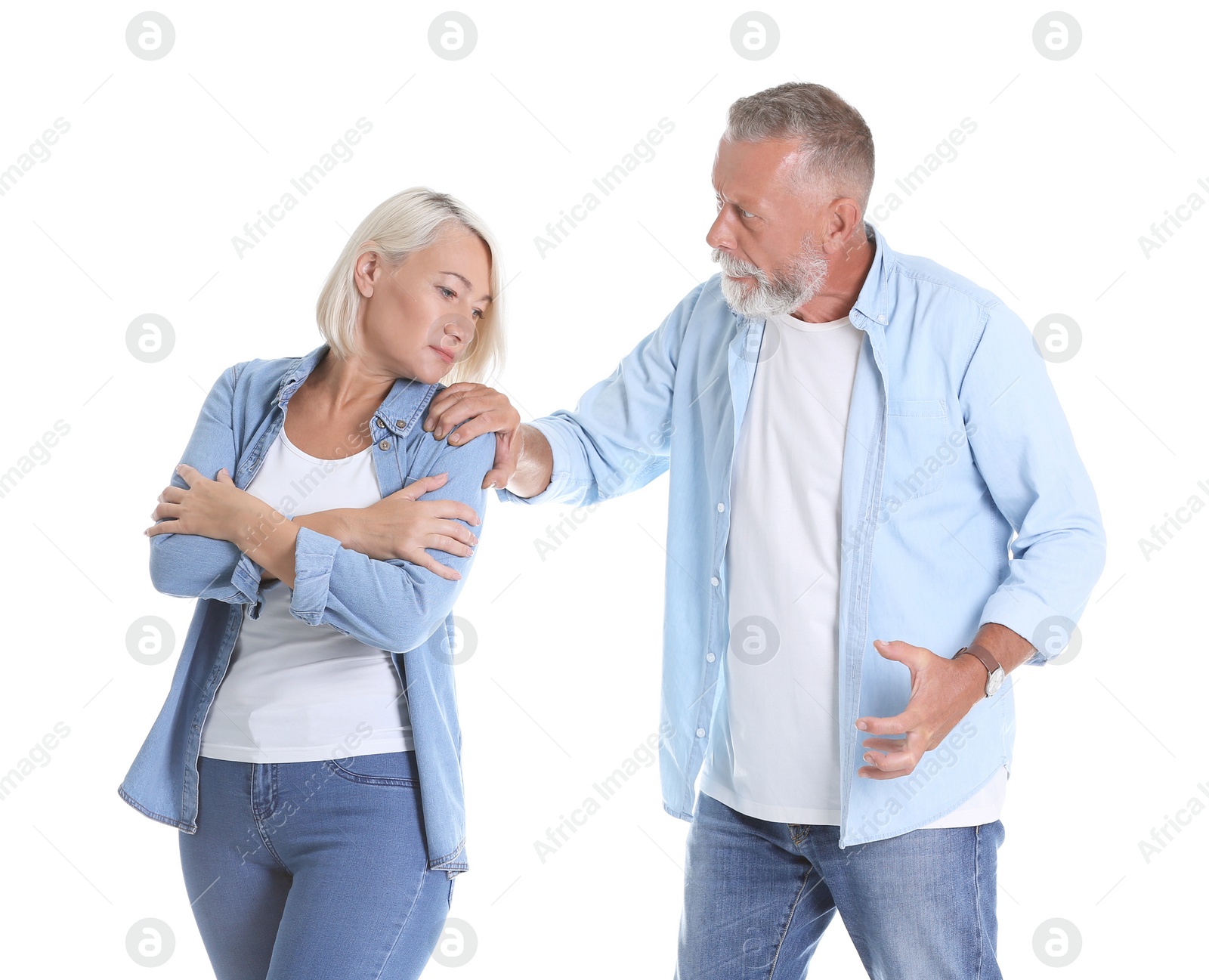 Photo of Mature couple having argument on white background. Relationship problems