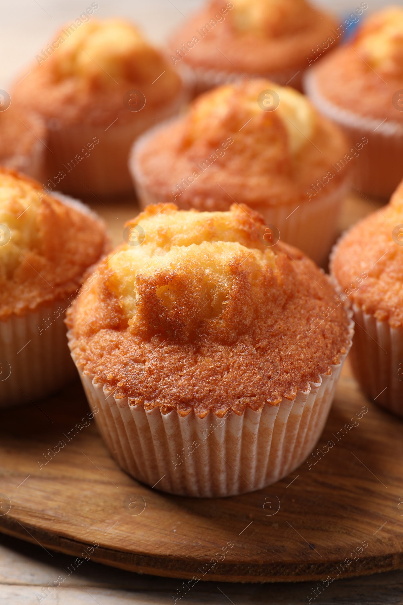 Photo of Delicious sweet muffins on table, closeup view