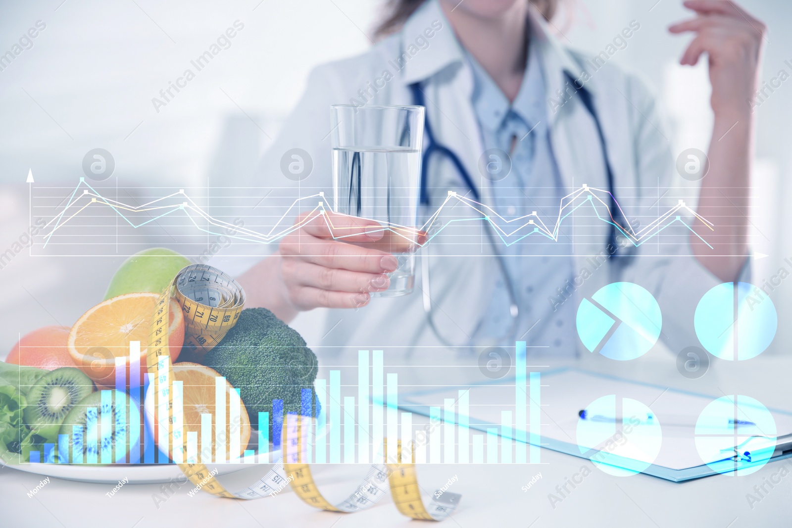 Image of Nutritionist with glass of water, ripe fruits, fresh vegetables and illustration of charts. Healthy eating