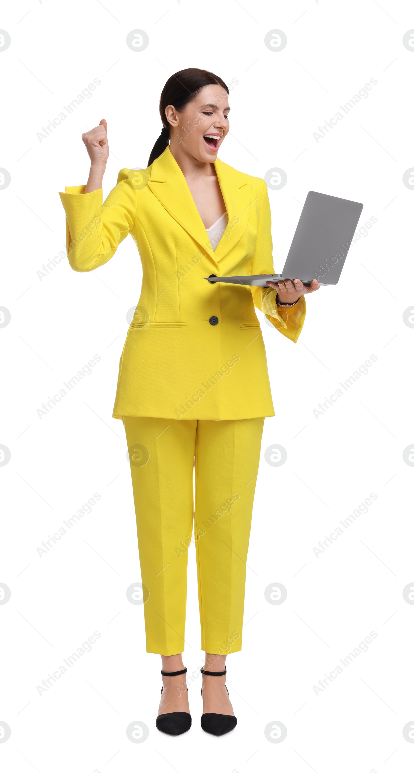 Photo of Beautiful businesswoman in yellow suit with laptop on white background