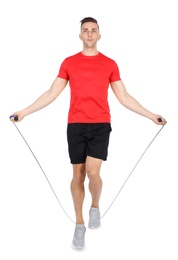 Photo of Full length portrait of young sportive man training with jump rope on white background