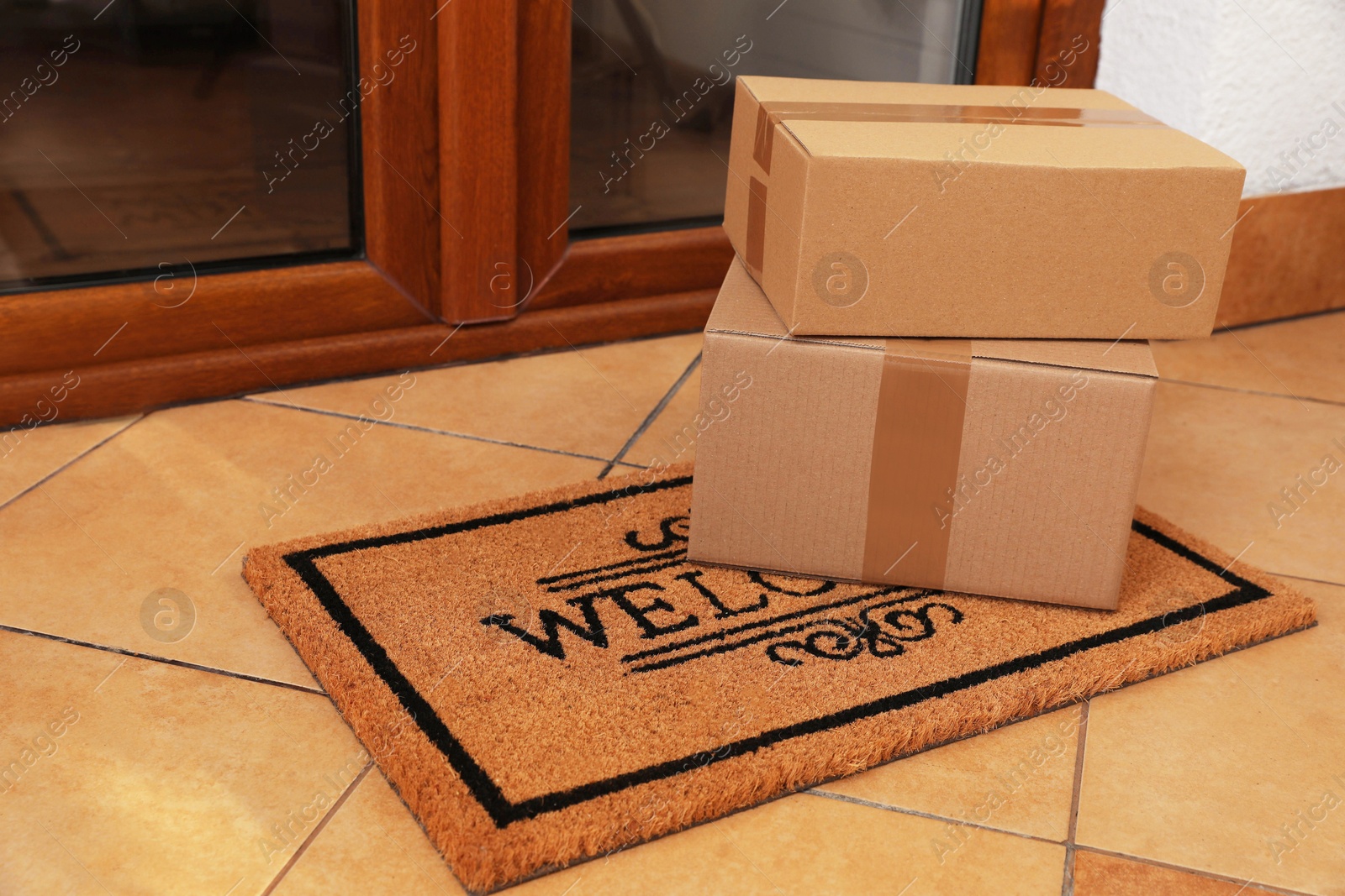 Photo of Parcels delivered on mat near front door