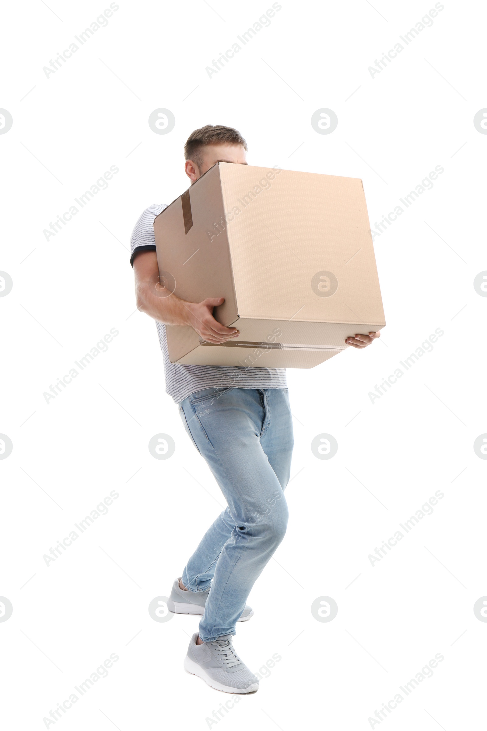 Photo of Young man carrying carton box on white background. Posture concept