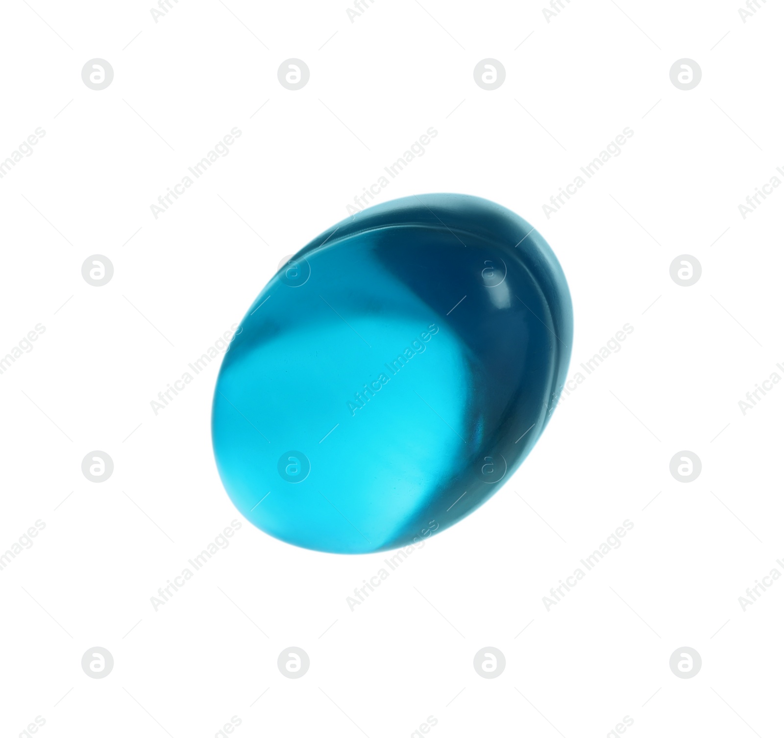 Photo of One light blue pill on white background. Medicinal treatment