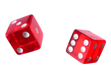 Two red dice in air on white background