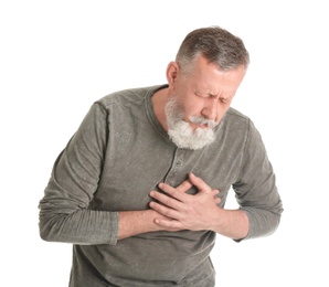 Mature man having heart attack on white background