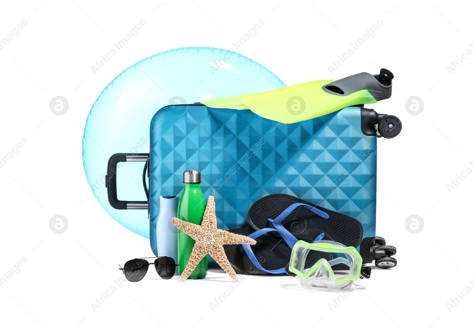 Photo of Suitcase, inflatable ring and other beach accessories isolated on white