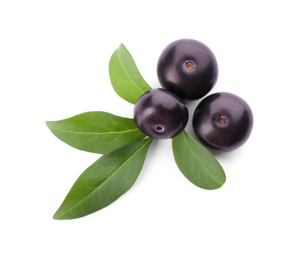 Fresh acai berries with leaves isolated on white, top view