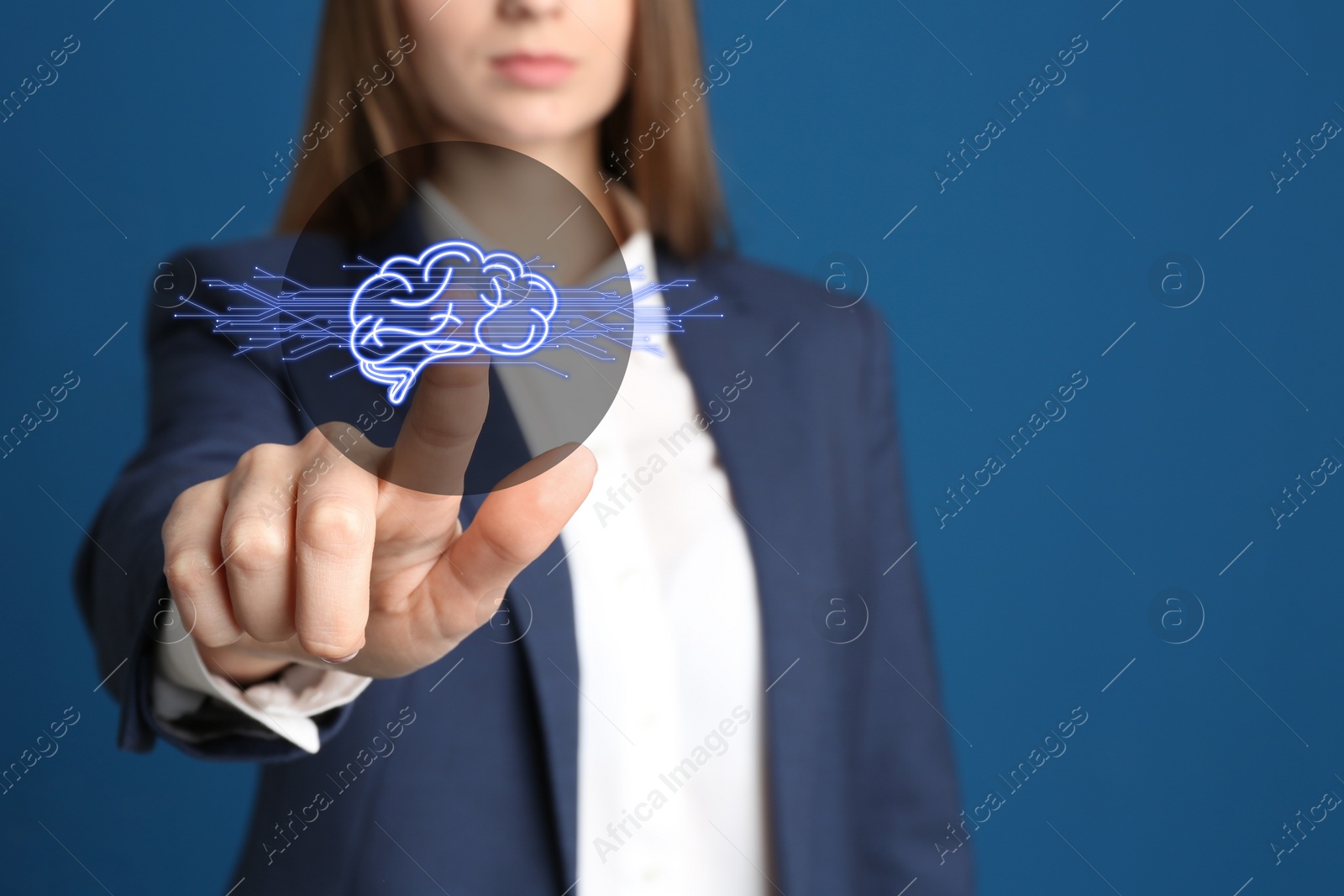 Image of Woman pointing at digital image of brain on blue background, closeup. Machine learning concept 