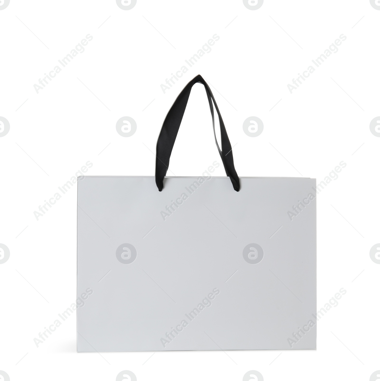 Photo of Paper shopping bag isolated on white. Mock up for design