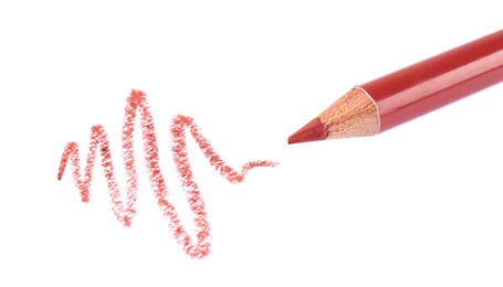 Photo of Bright lip liner stroke and pencil on white background