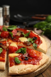 Delicious homemade pita pizza on wooden table, closeup