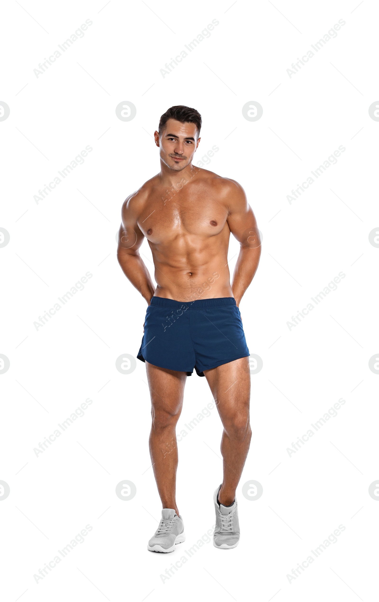 Photo of Handsome young runner posing on white background