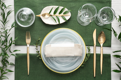 Elegant festive setting on white wooden table, flat lay