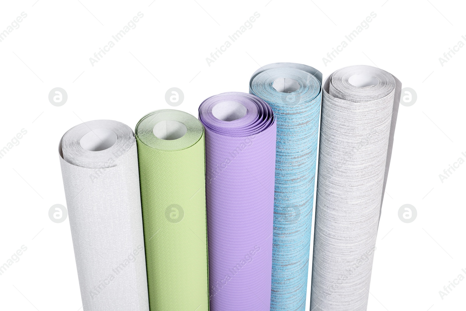 Photo of Many different wallpaper rolls isolated on white