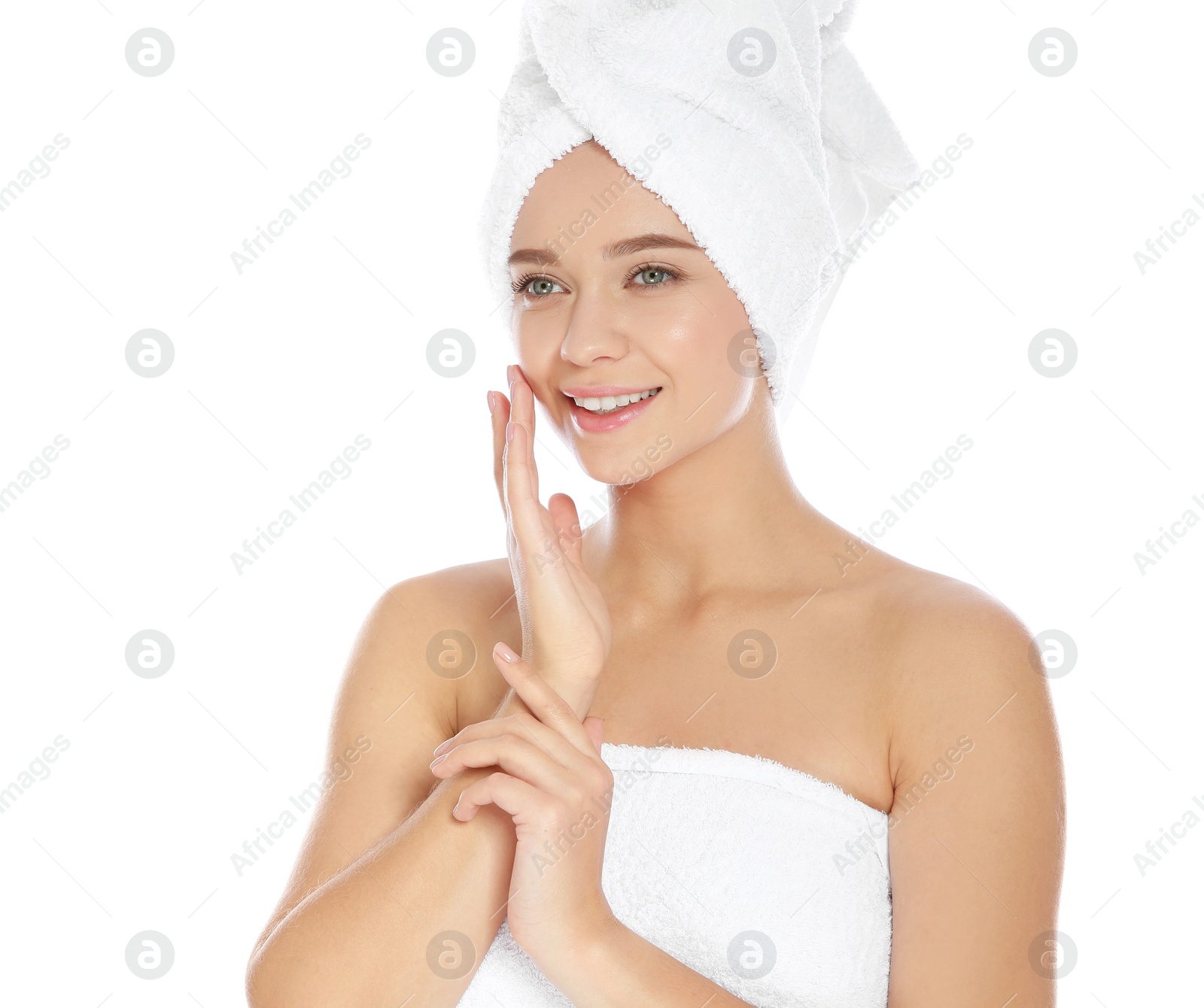 Photo of Portrait of young pretty woman with towels on white background