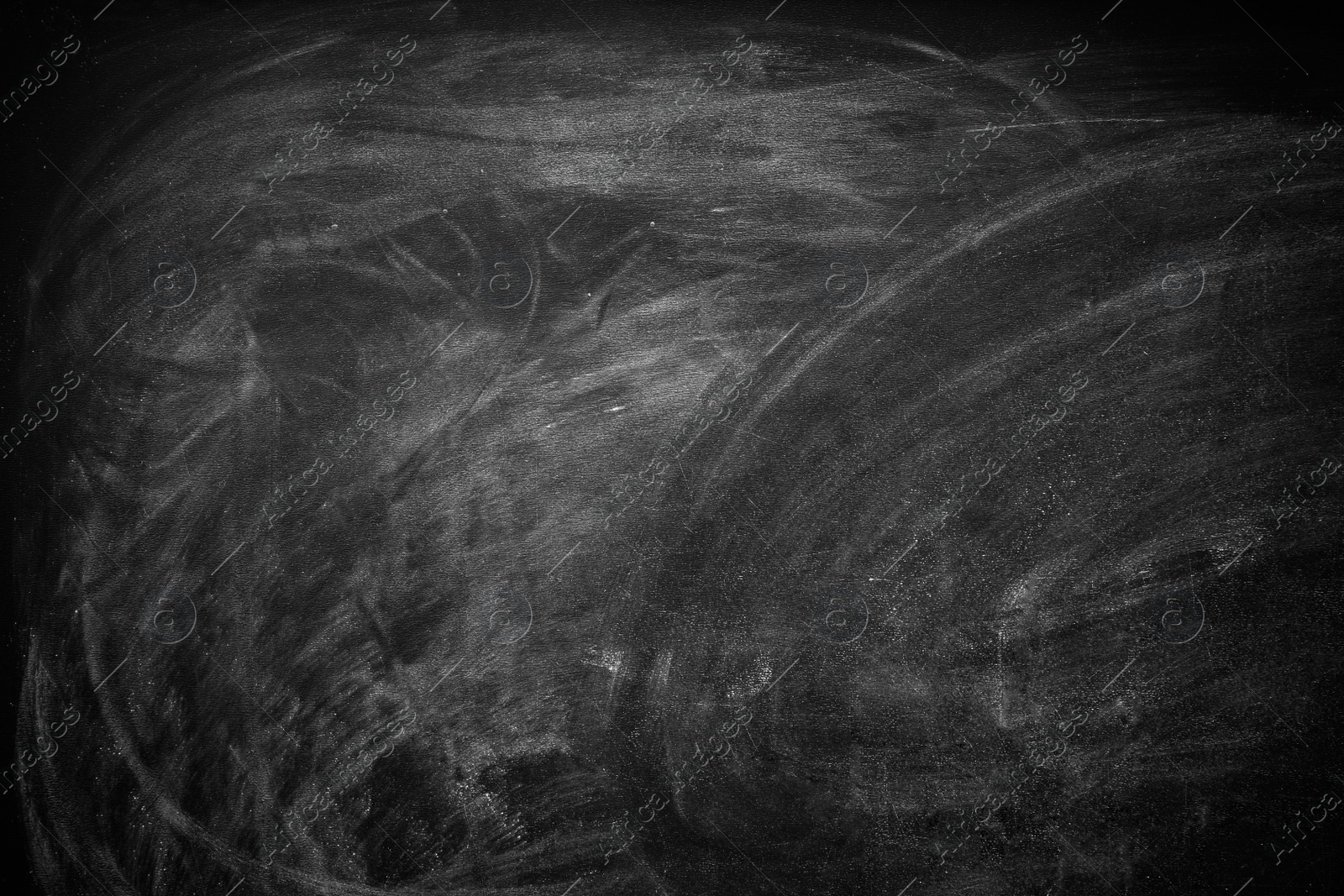 Photo of Chalk rubbed out on blackboard as background. Space for text
