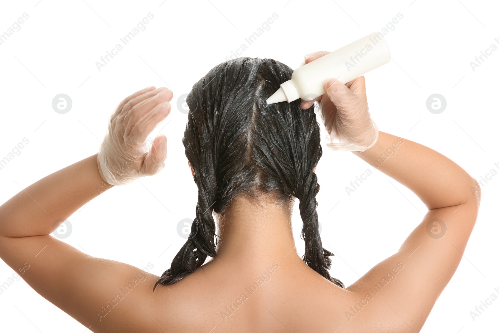 Photo of Young woman dyeing her hair against white background, back view