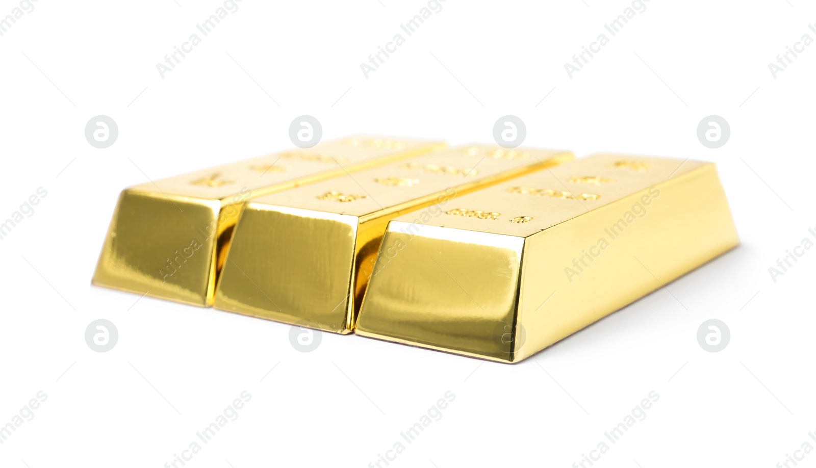 Photo of Three shining gold bars isolated on white