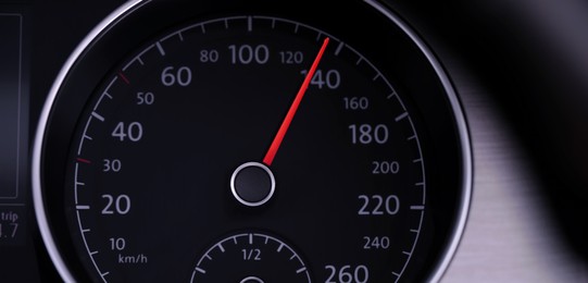 Speedometer on car dashboard, closeup. Banner design