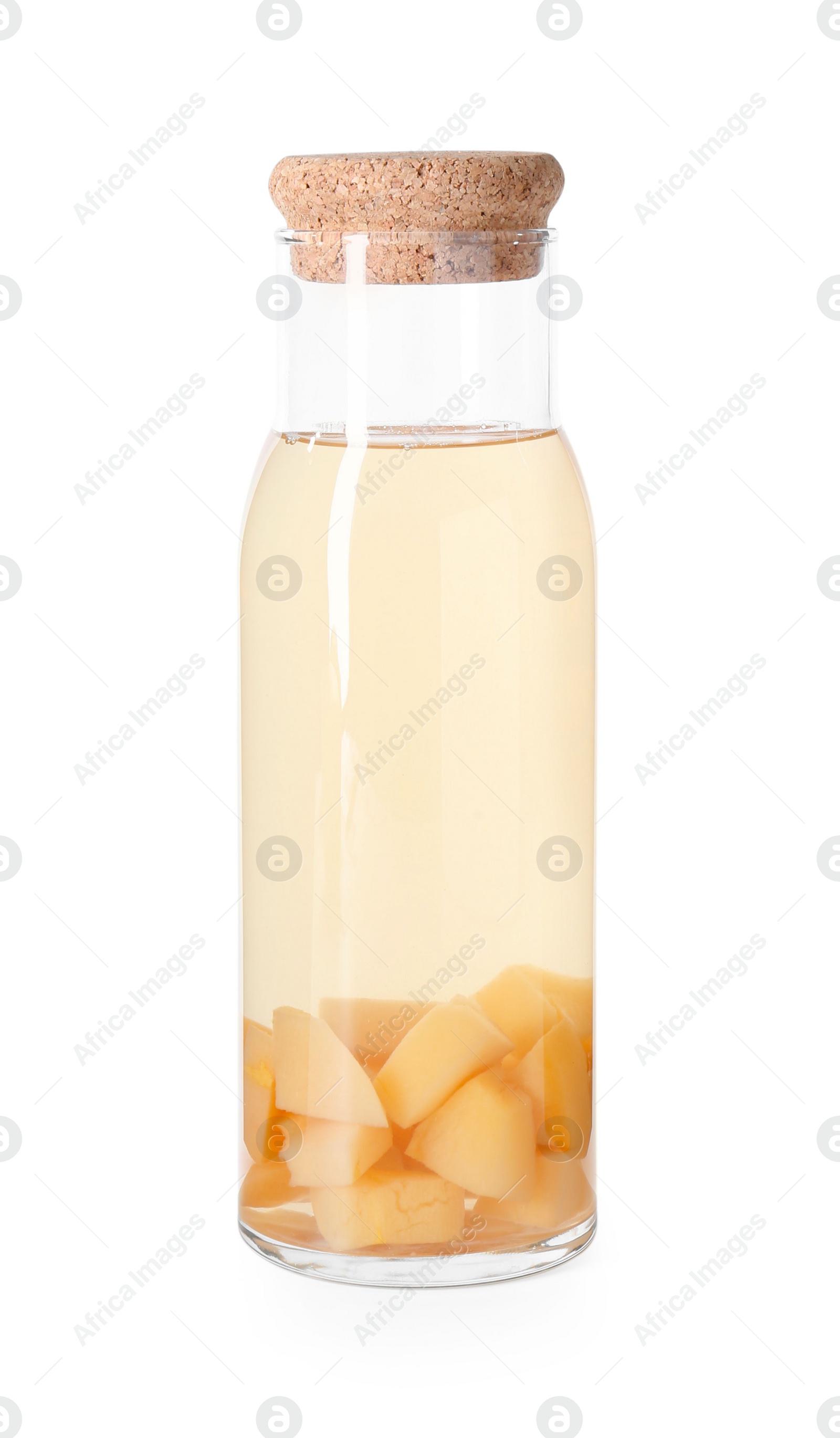 Photo of Tasty quince drink in glass carafe isolated on white
