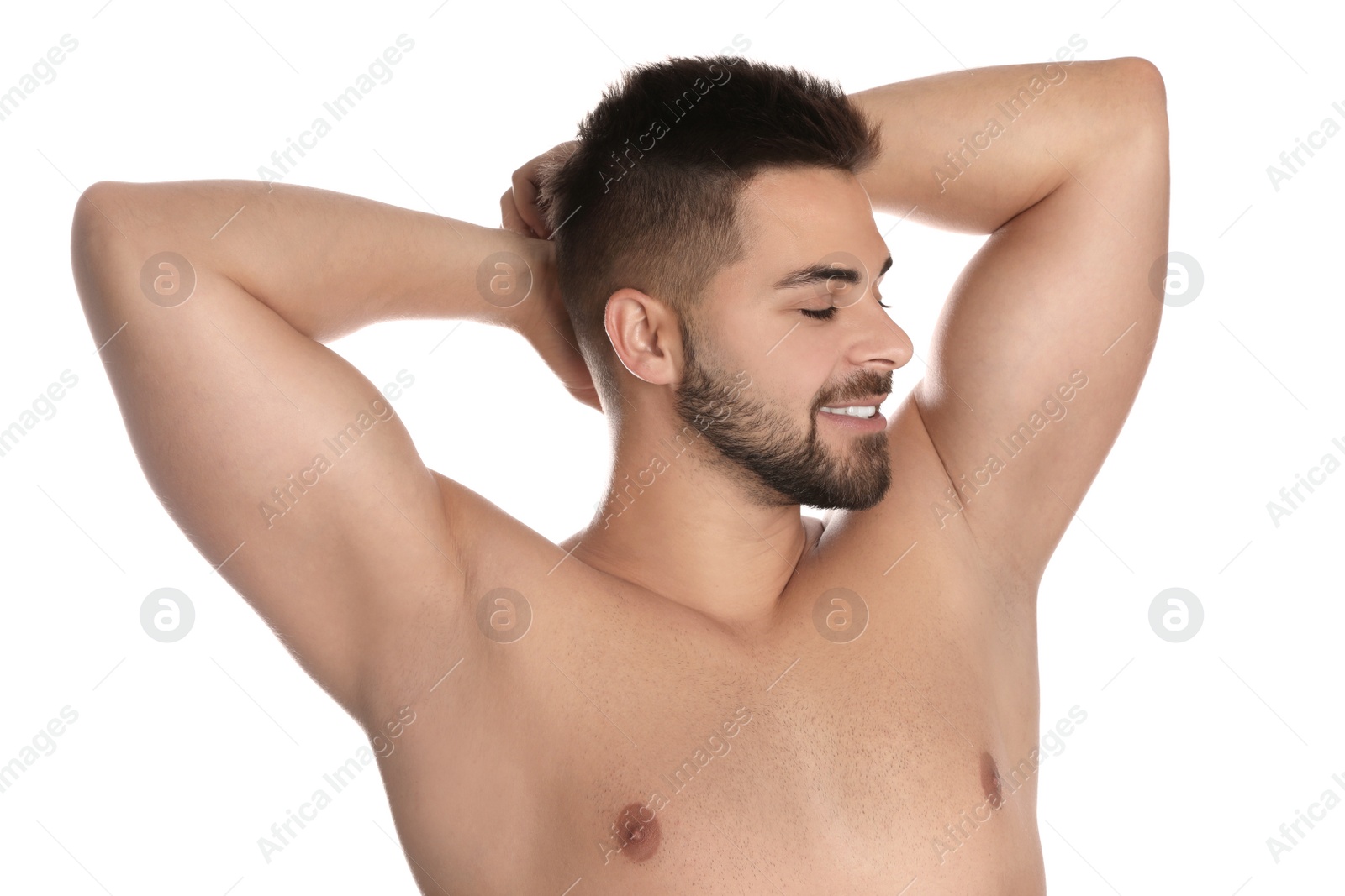 Image of Young man showing hairless armpits after epilation procedure on white background