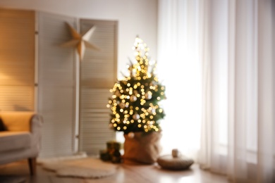 Photo of Stylish room interior with elegant Christmas decor, blurred view
