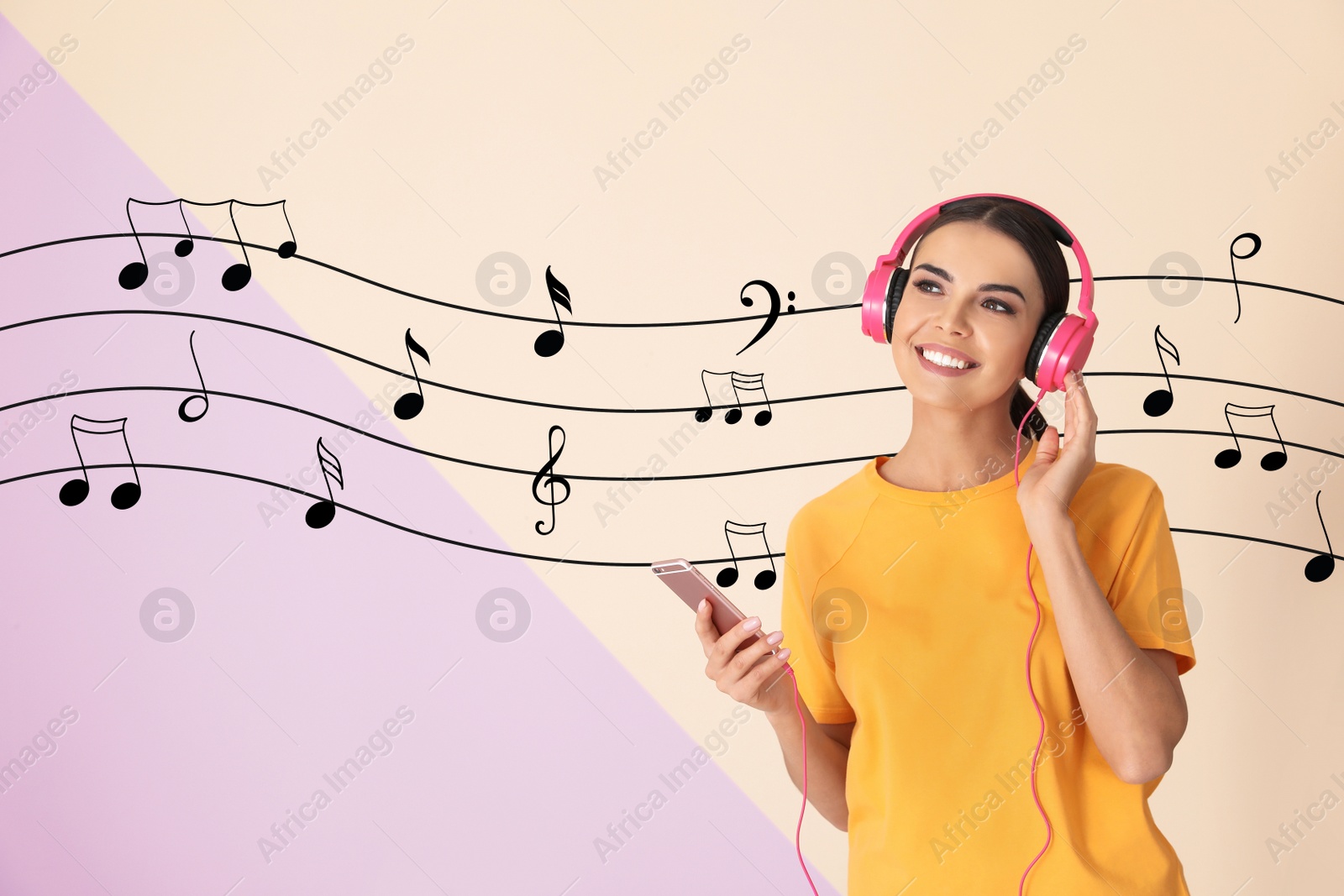 Image of Attractive woman with mobile phone listening to music via headphones on color background