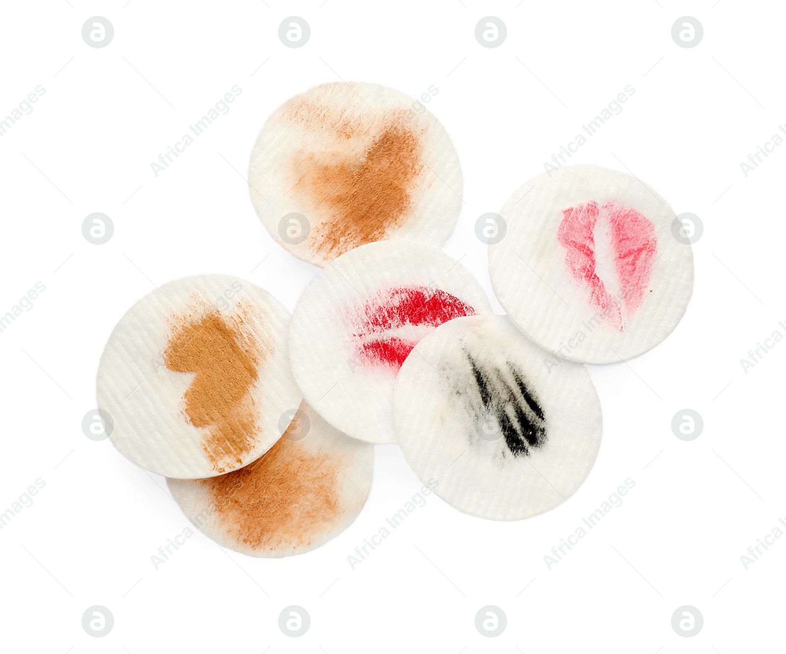 Photo of Dirty cotton pads after removing makeup on white background, flat lay