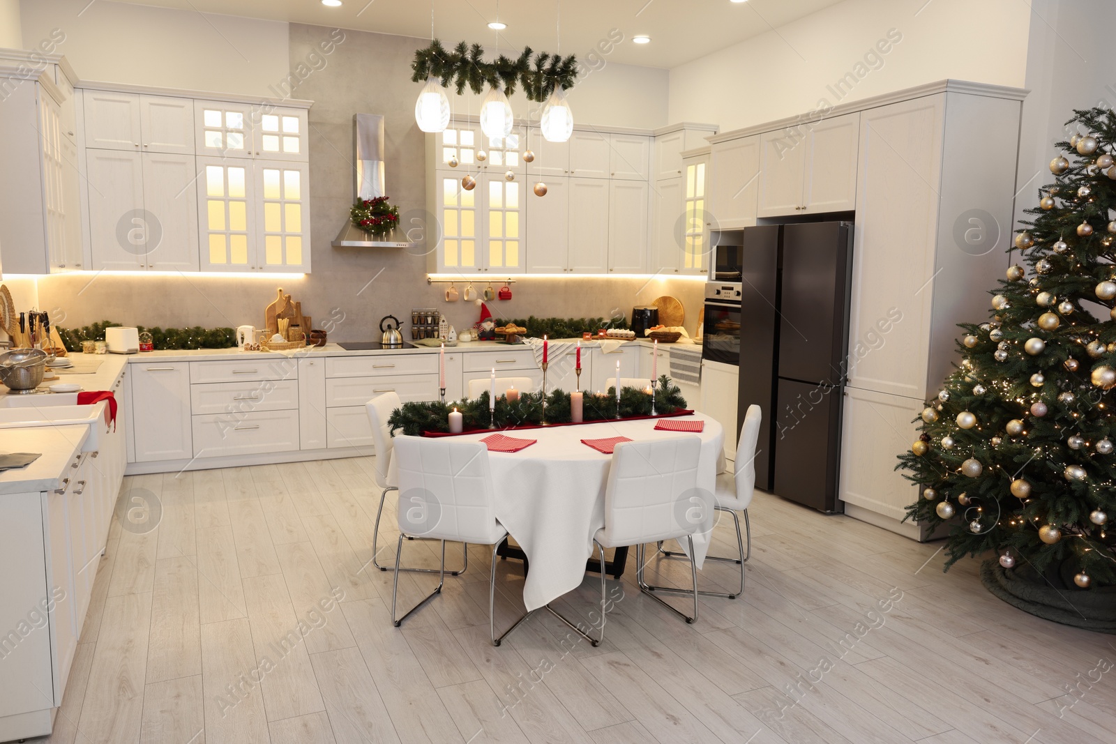 Photo of Cozy spacious kitchen decorated for Christmas. Interior design