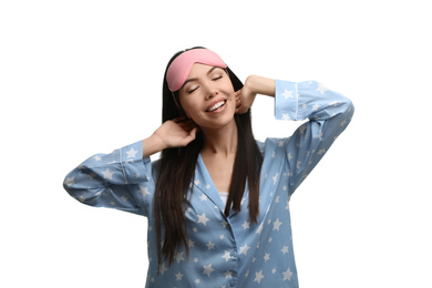 Photo of Beautiful Asian woman wearing pajamas and sleeping mask on white background. Bedtime