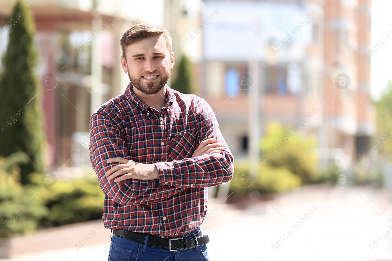 Photo of Portrait of young man in stylish outfit outdoors