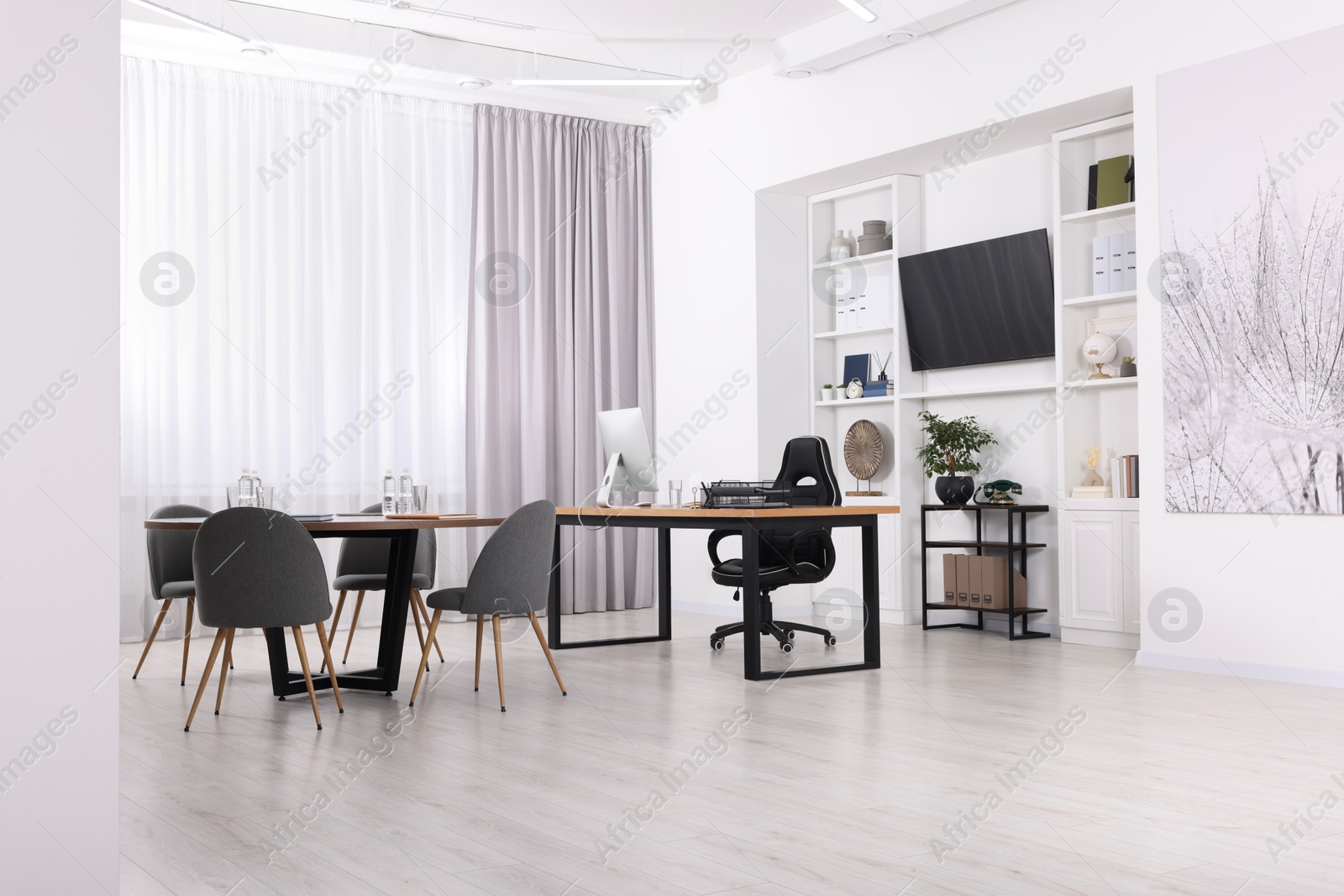 Photo of Stylish office with comfortable furniture and tv zone. Interior design