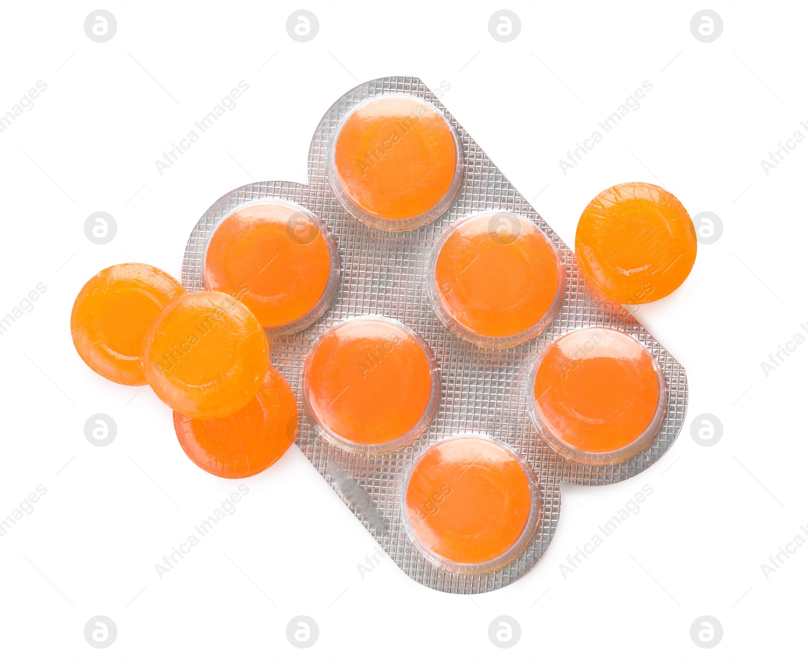 Photo of Many orange cough drops on white background, top view