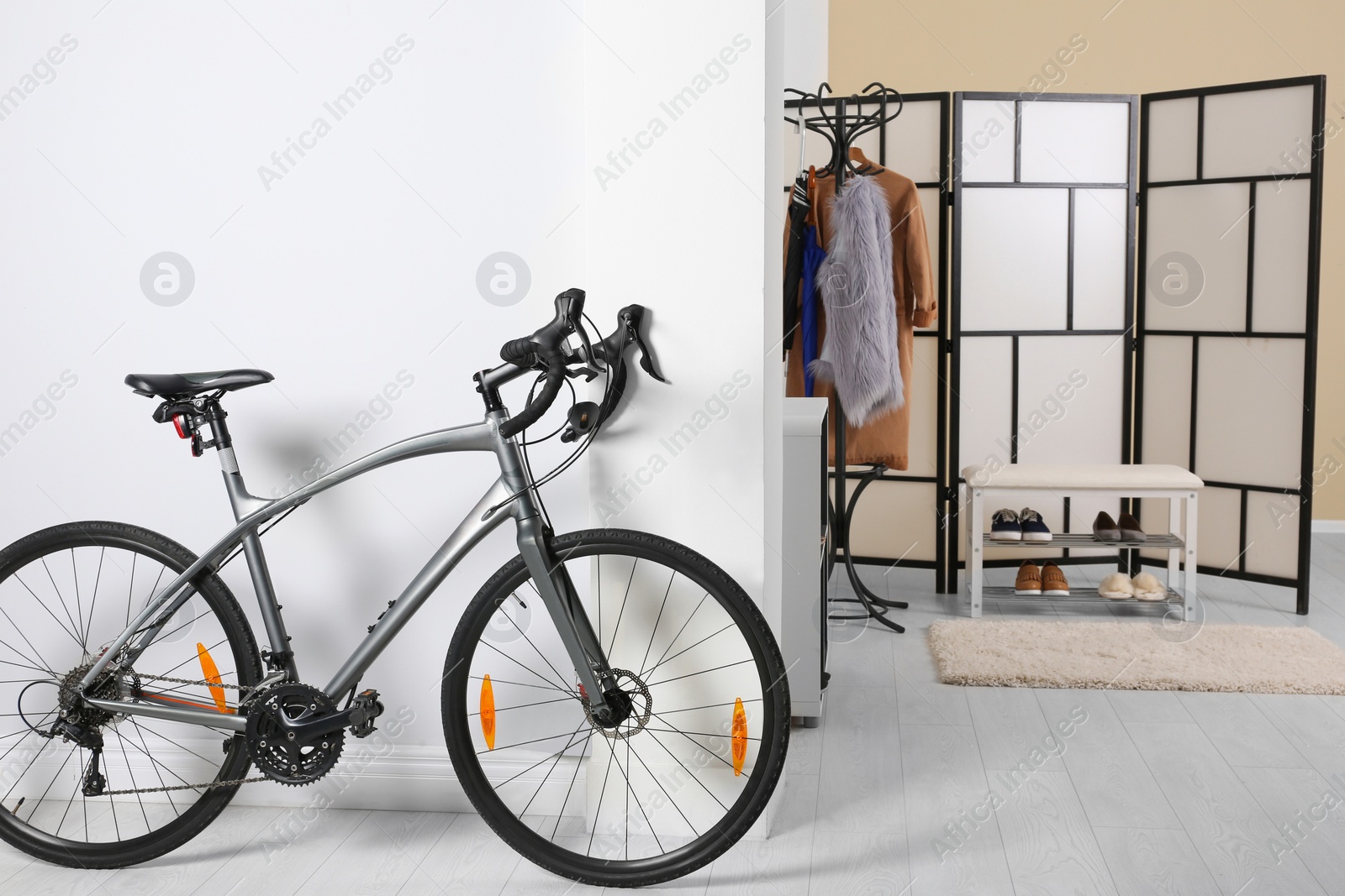Photo of Modern apartment interior with bicycle near wall