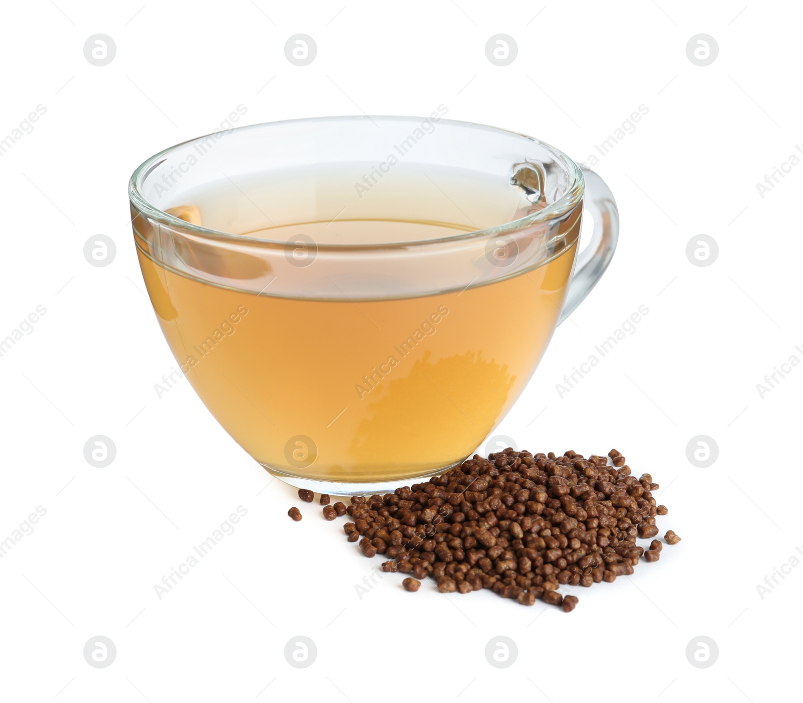 Photo of Glass cup of buckwheat tea and granules on white background