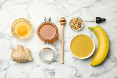 Photo of Different ingredients and handmade face mask on white marble background, flat lay