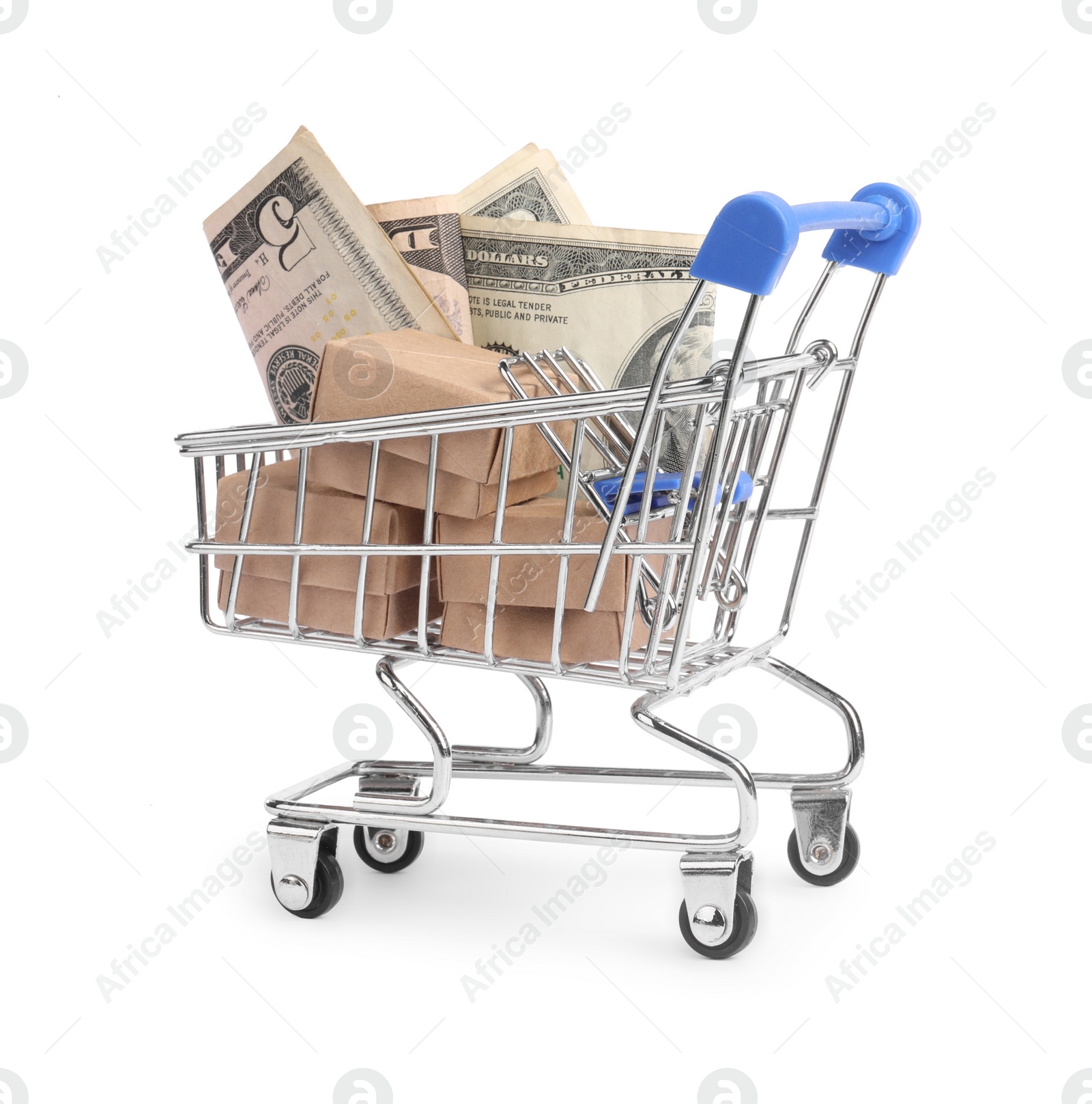 Photo of Small metal shopping cart with boxes and dollar bills isolated on white