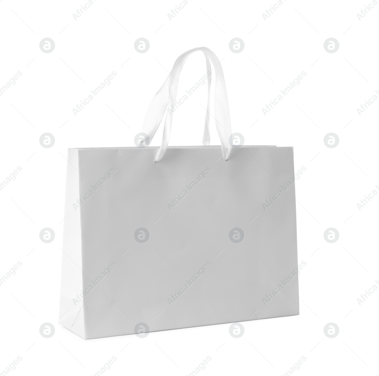 Photo of Paper shopping bag isolated on white. Mock up for design