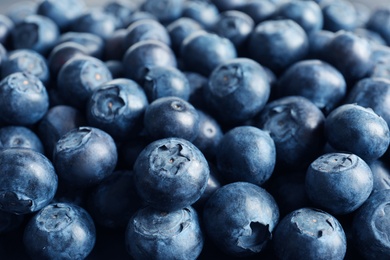 Photo of Fresh raw blueberries as background, closeup view