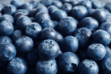 Fresh raw blueberries as background, closeup view