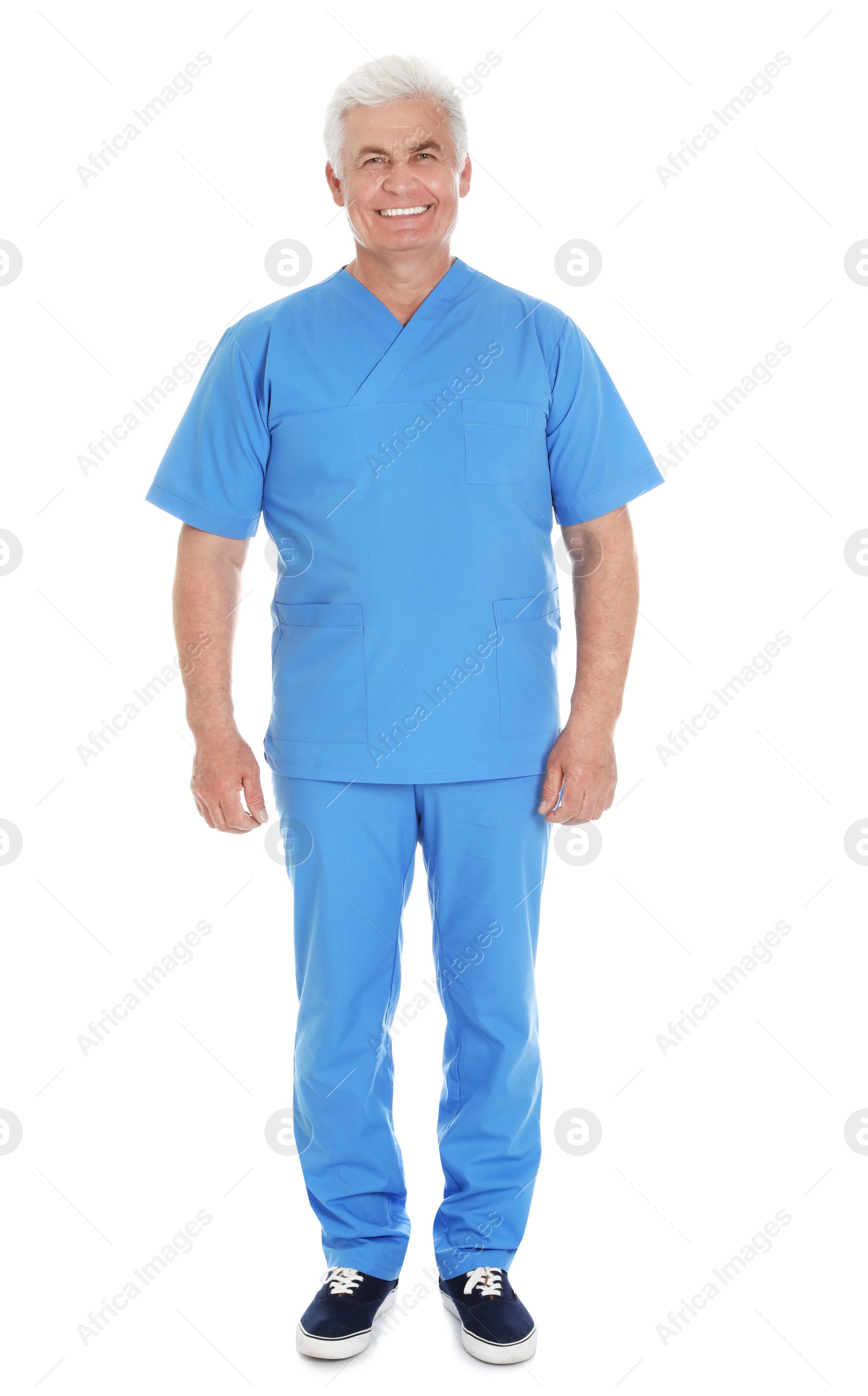 Photo of Full length portrait of male doctor in scrubs isolated on white. Medical staff